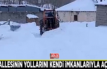 Mahallesinin yollarını kendi imkanlarıyla açıyor